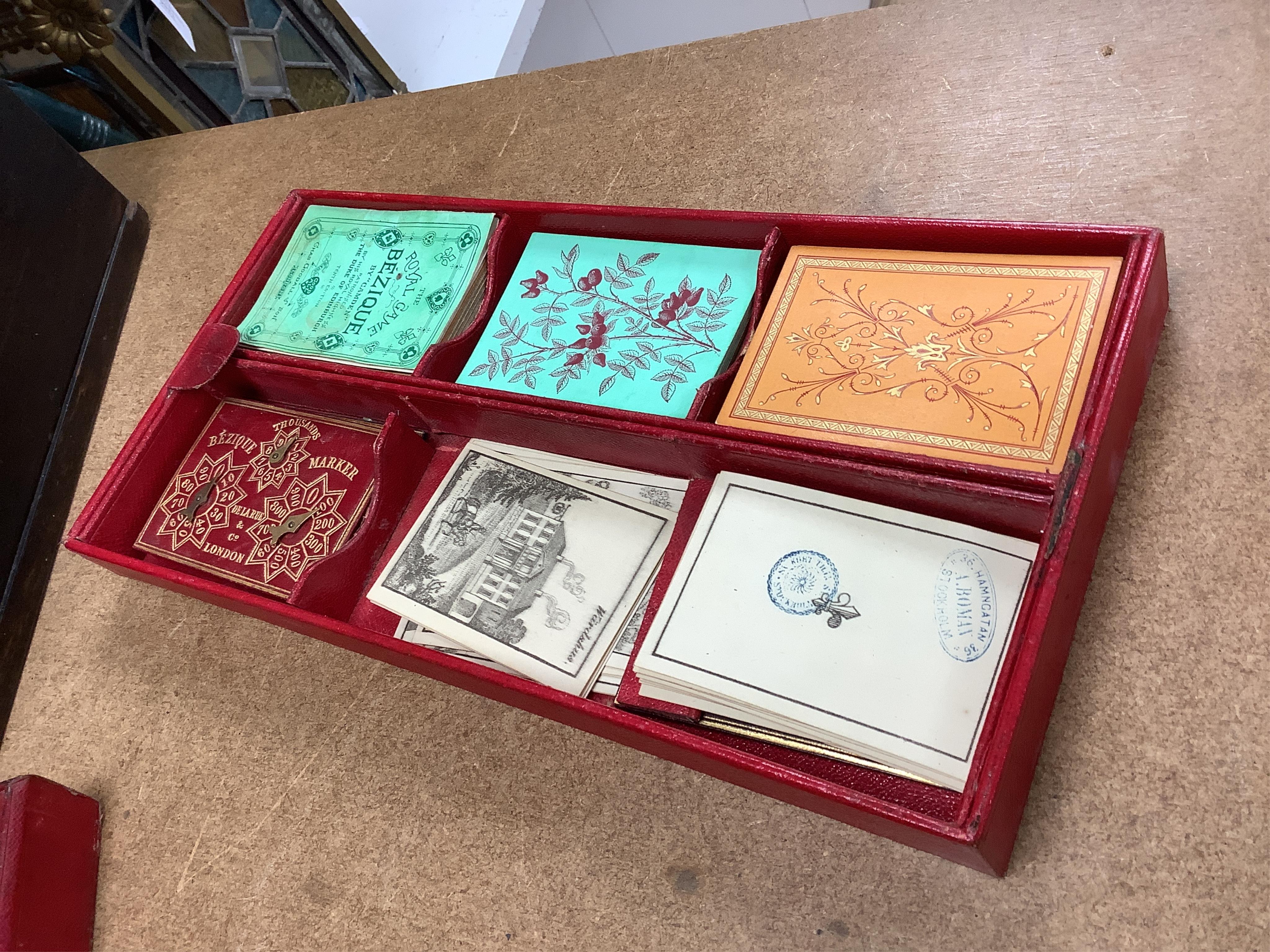 A Victorian coromandel games box with accessories, ivory chess pieces and counters, box 36cm wide x 19cm high. Condition - red interior leather worn and torn in places and box scratched, minor losses to chess pieces. CIT